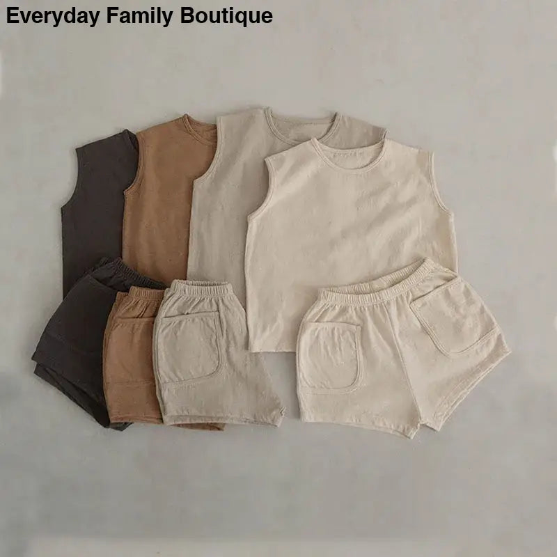 Sleeveless shirt and shorts sets in neutral earth tones.