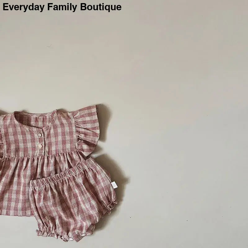 Pink and white gingham baby dress with matching bloomers.