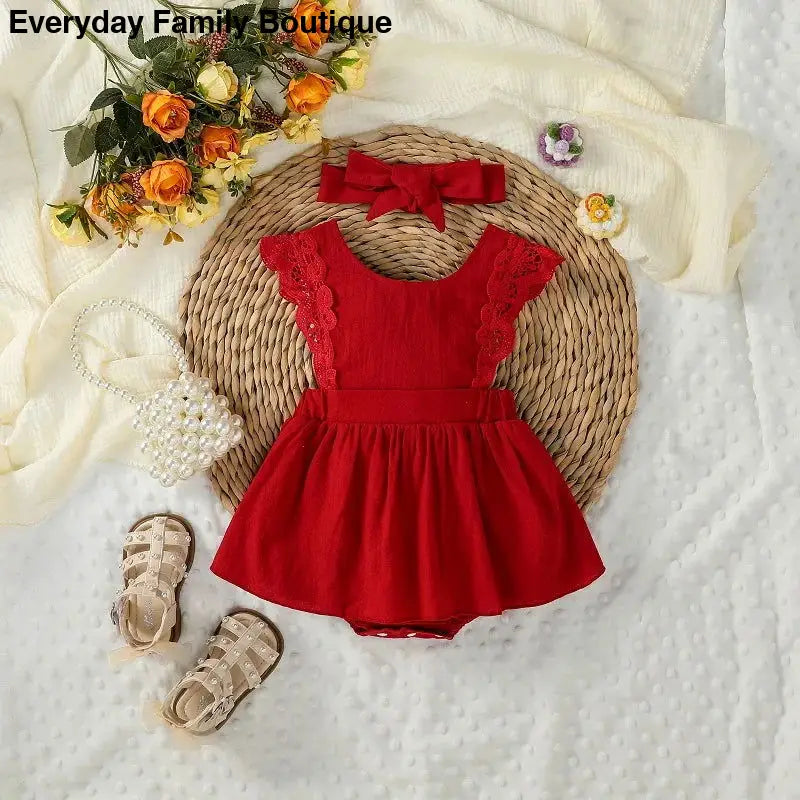 Red ruffled dress with flutter sleeves and a bow accent.