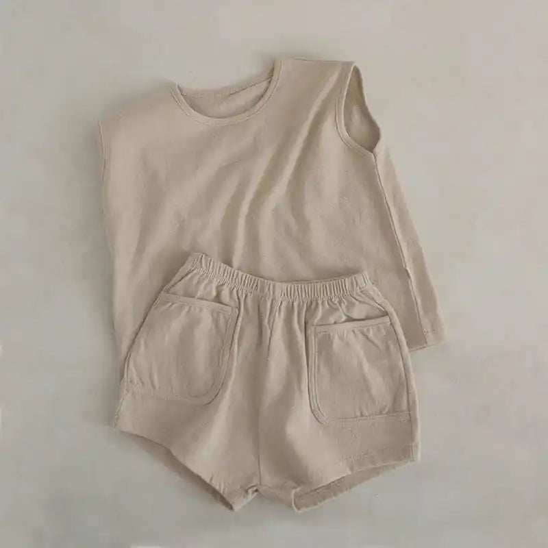 Beige sleeveless top and matching shorts set.