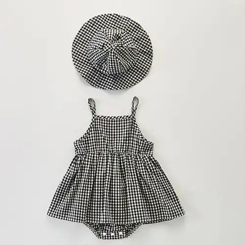 Black and white gingham dress with matching hat for a baby.