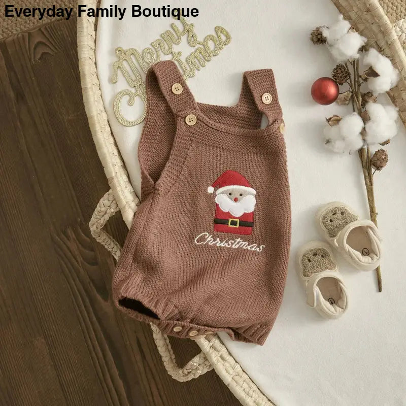 Brown knitted baby romper with a Santa Claus embroidery design.