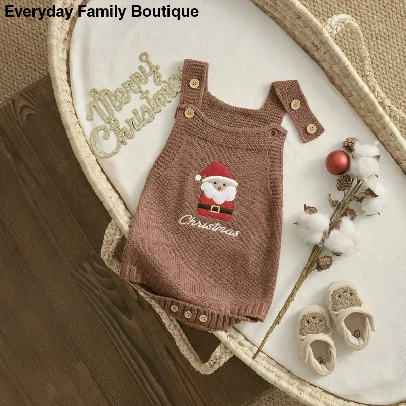 Brown knit baby overalls with an embroidered Santa Claus design.