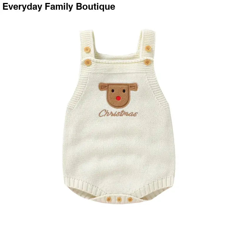 White knitted baby romper with a reindeer face design and ’Christmas’ embroidery.