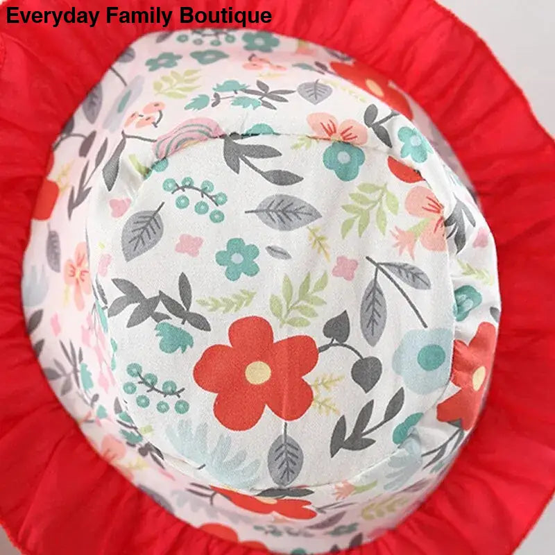 Floral-patterned paper plate with a red ruffled border.