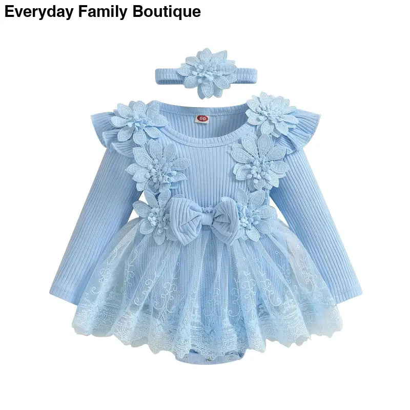 Light blue baby dress with floral appliques, lace trim, and matching headband.