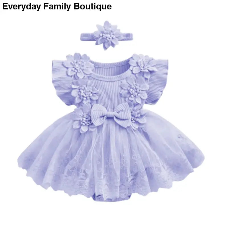 Lavender tulle baby dress with floral appliques and matching headband.