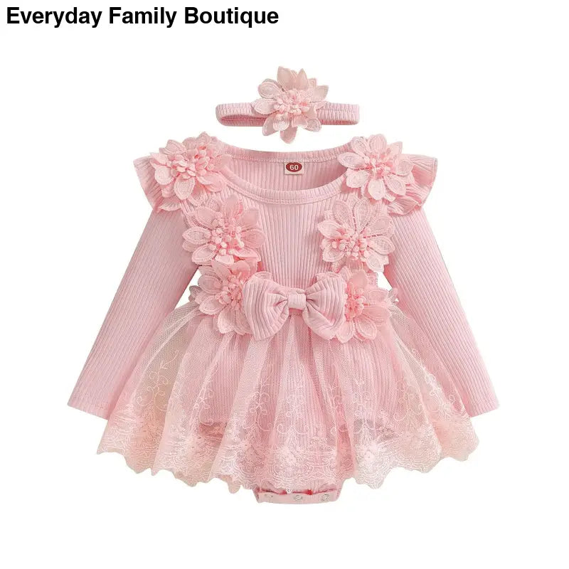 Pink floral baby dress with tulle skirt and matching headband.