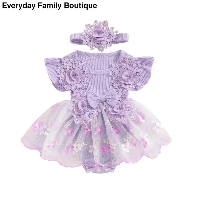 Lavender baby dress romper with floral lace trim, tulle skirt, and matching headband.