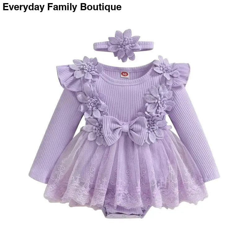 Lavender baby dress-romper with floral appliques, tulle skirt, and matching headband.