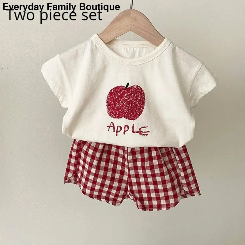 White t-shirt and red gingham shorts set with a glittery apple design.