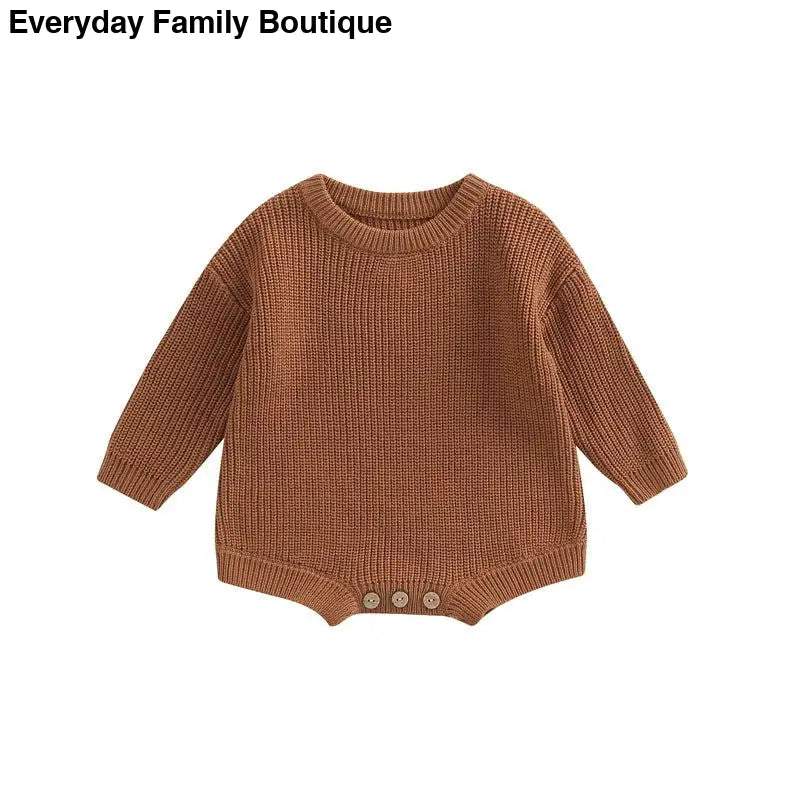 Brown knitted baby romper with button details at the bottom.