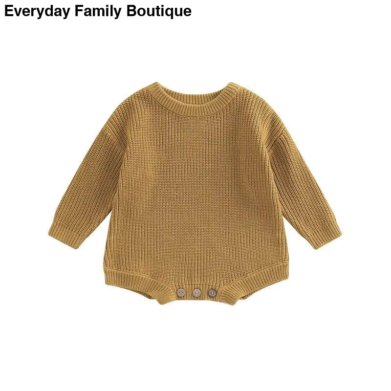 Caramel-colored knit baby romper with long sleeves and button closures at bottom.