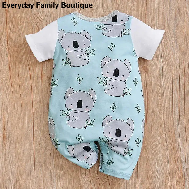 Baby romper with cute koala pattern on mint green fabric.