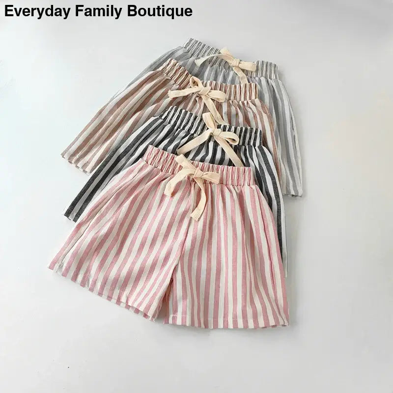 Striped cotton shorts with drawstring waistbands in various pastel colors.