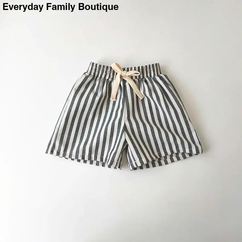 Striped gray and white shorts with a drawstring waist.