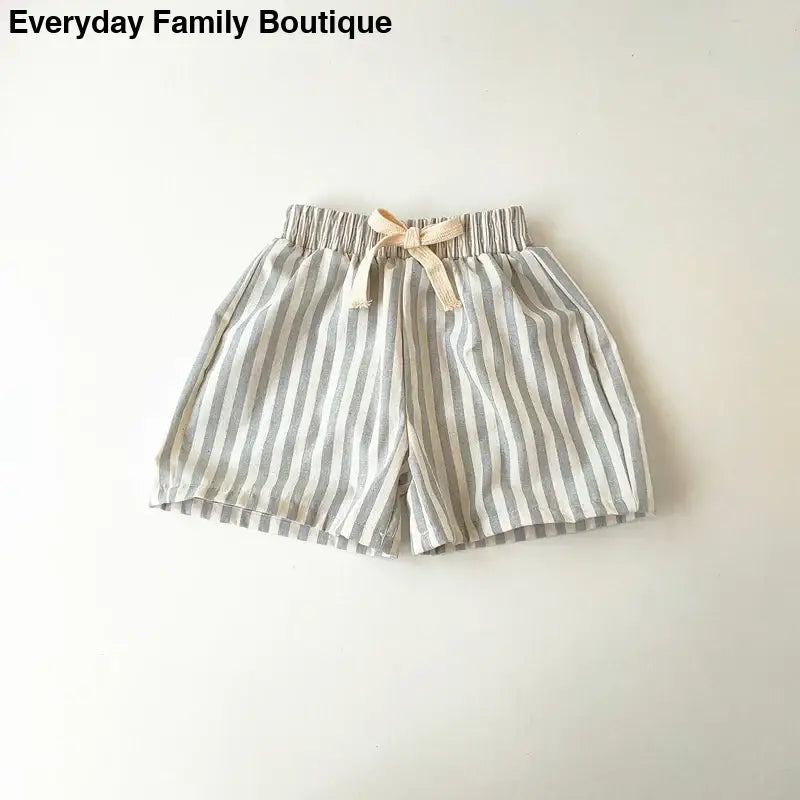 Striped gray and white cotton shorts with a drawstring waist.