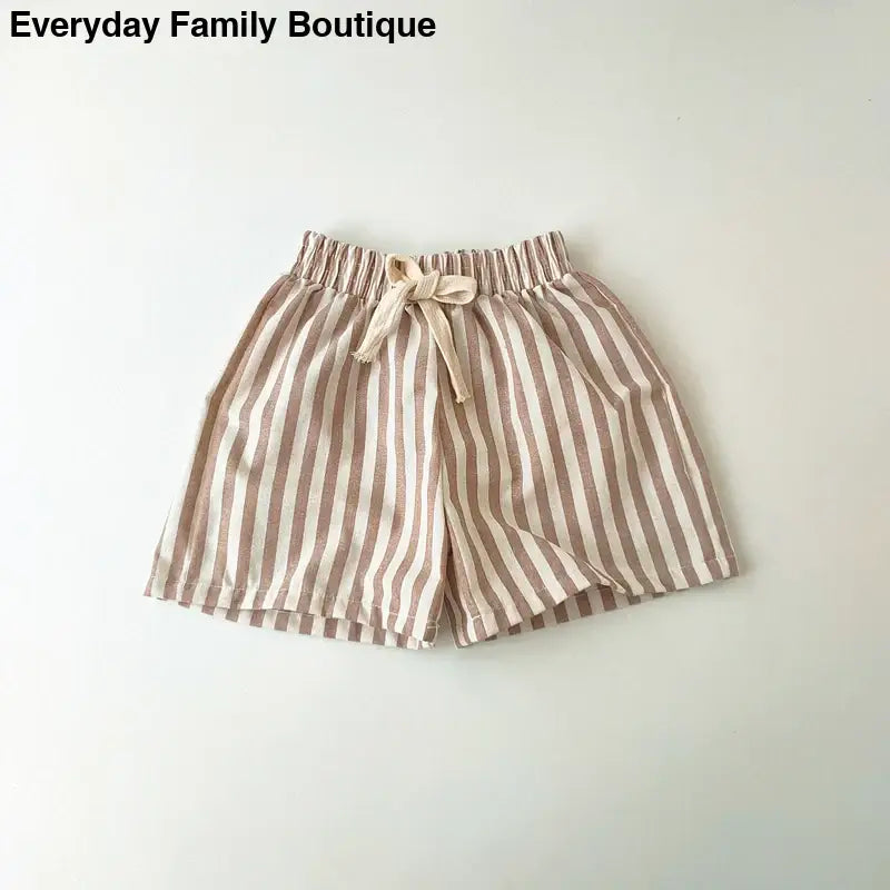 Beige and white striped shorts with a drawstring waist.