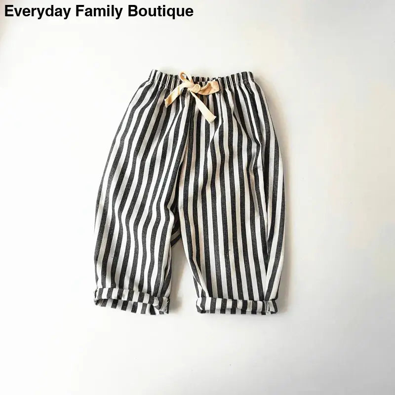 Black and white striped pants with a drawstring waist.