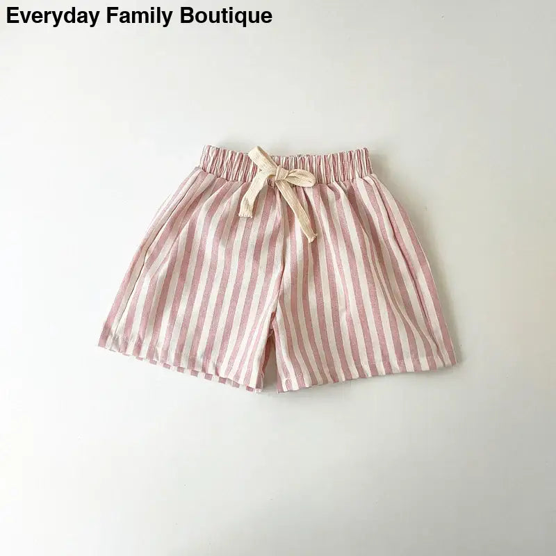 Pink and white striped shorts with a drawstring waist.