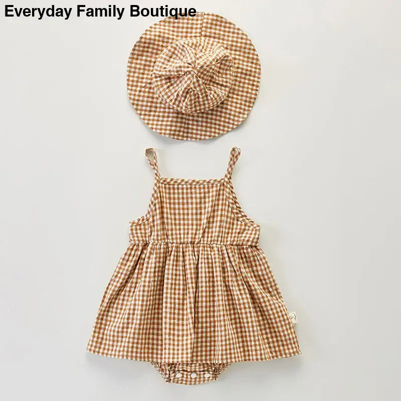 Brown and white gingham baby dress with matching hat.