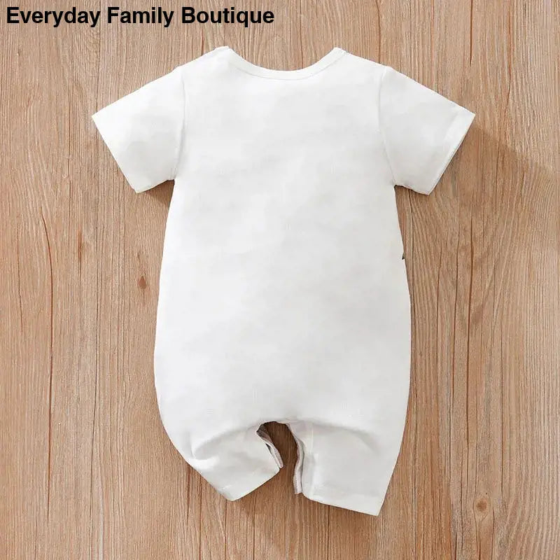 White short-sleeved baby romper with leg openings.