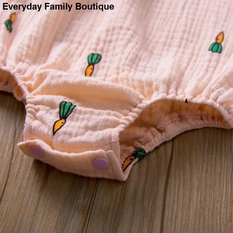 Pink cotton underwear with small carrot print pattern.