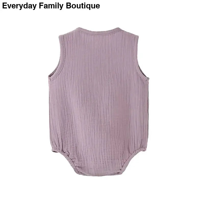 Sleeveless mauve cotton romper with a textured crinkle fabric.