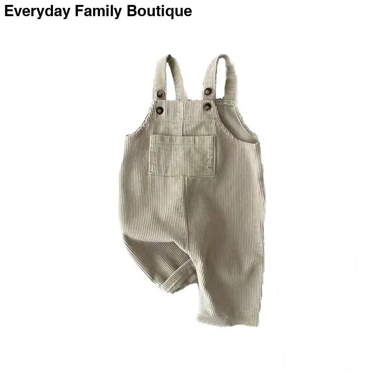 Beige corduroy overalls with shoulder straps and a front pocket.