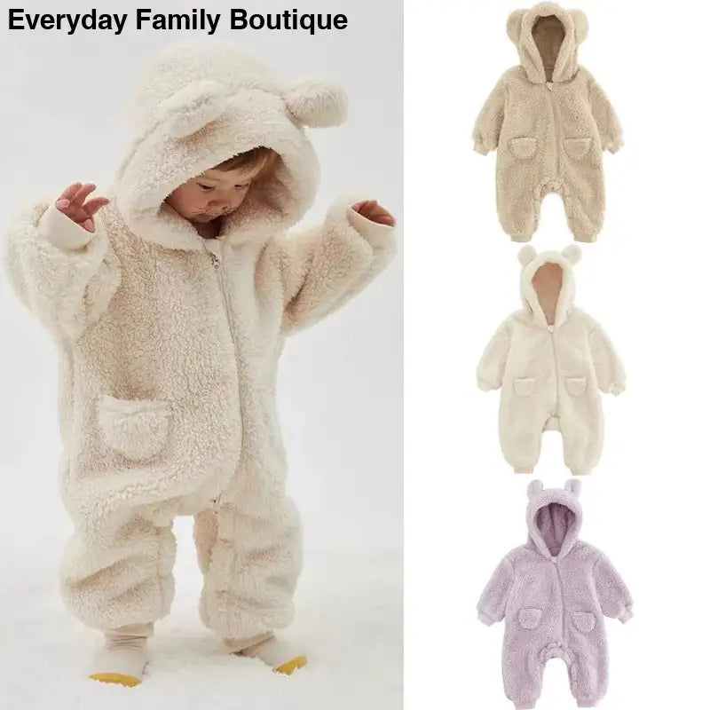 Cozy fleece baby snowsuit with bear ears on the hood and front pockets.