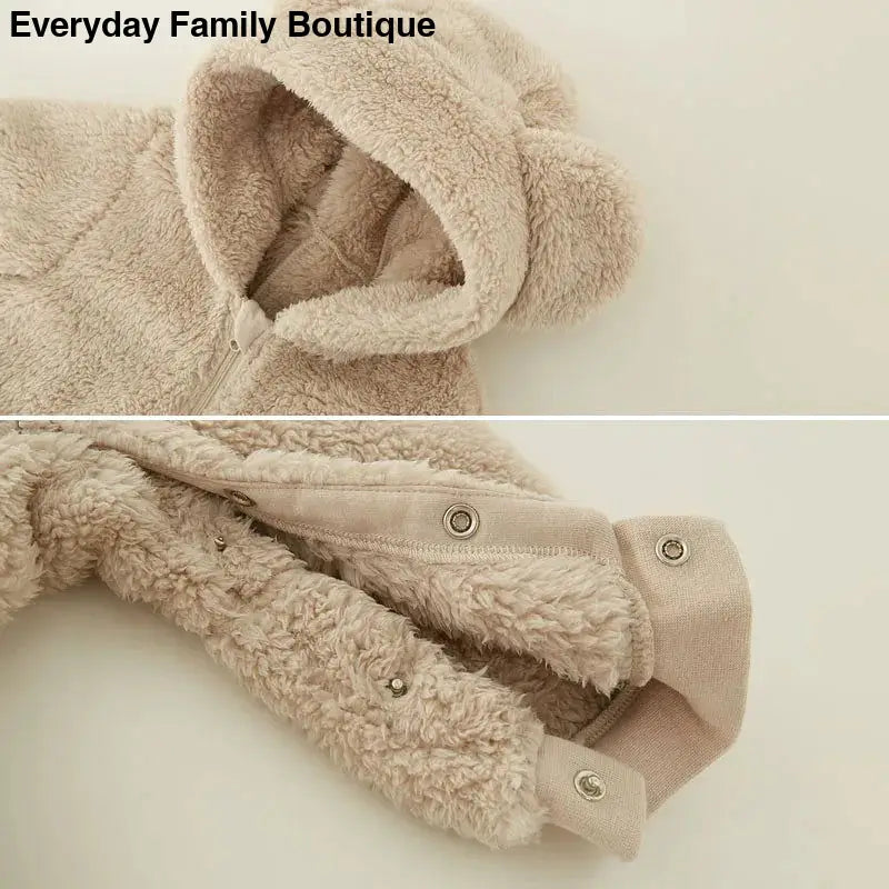 Plush beige hooded coat with snap button closures.