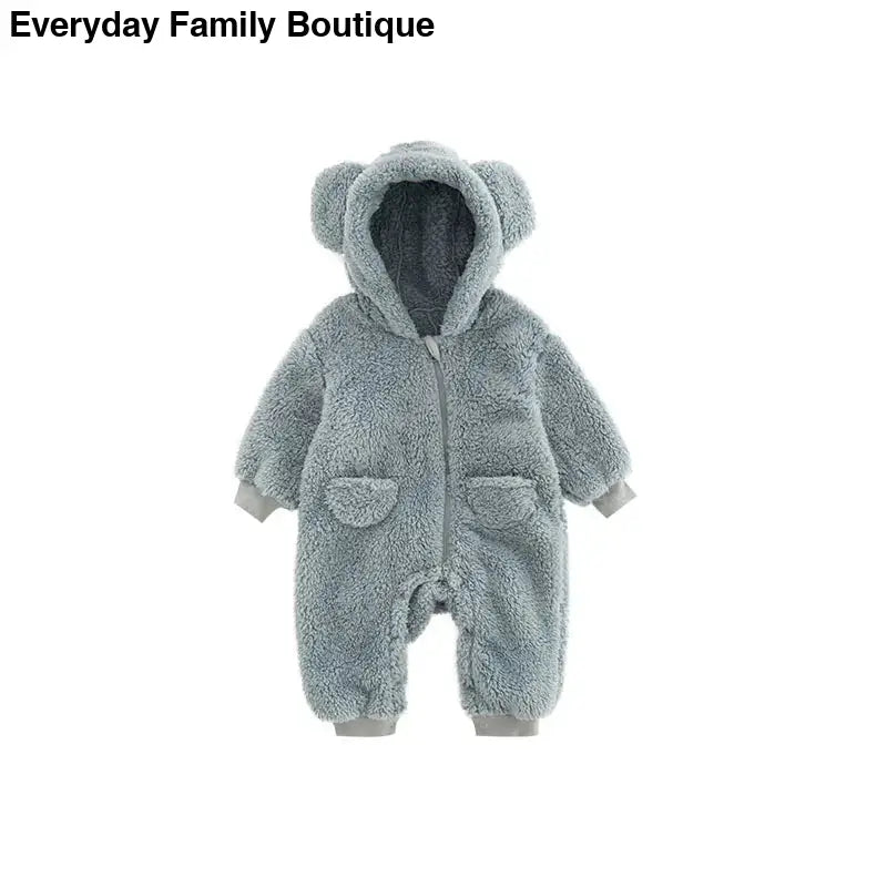 Gray fleece baby romper with bear ears on the hood and front pockets.