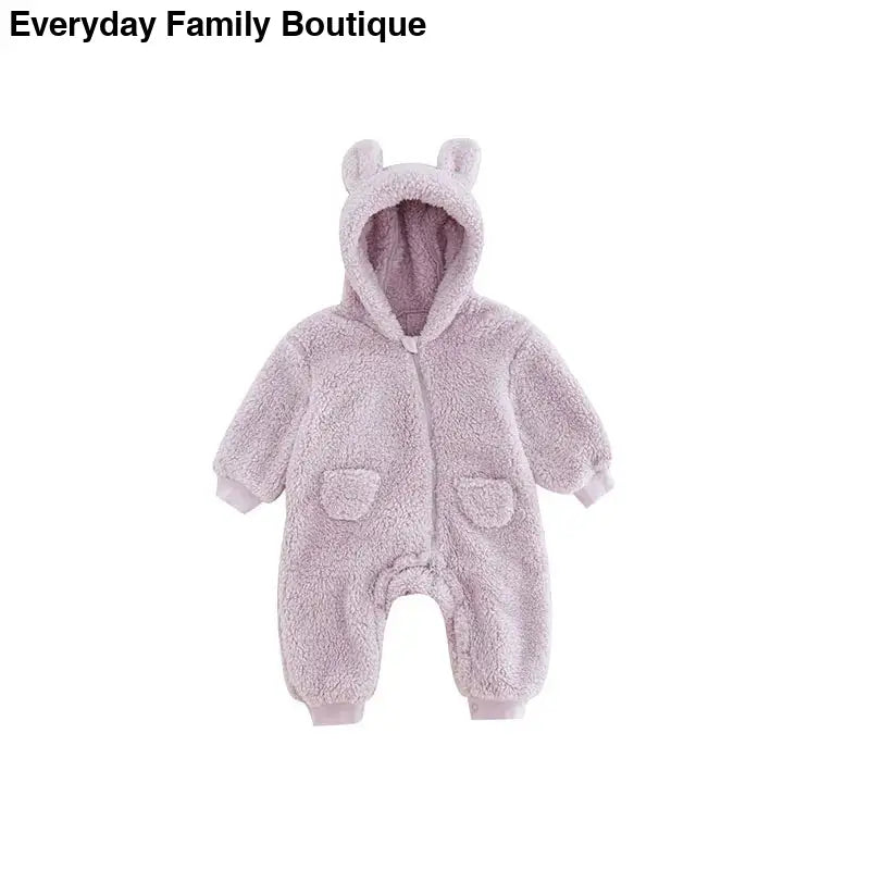 Soft lavender teddy bear-style baby snowsuit with ears and front pockets.